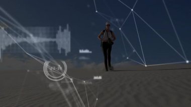 Kadın yürüyüşçülerin alçalan kum tepecikleri teknoloji HUD 'yi ağ çizelgeleri takip hareketleriyle örtüyor. Macera, keşif, veri görselleştirme, giyilebilir teknoloji, açık hava aktivitesi, geleceksel, navigasyon