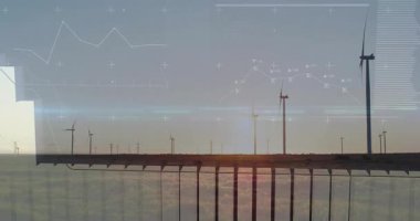 Lens flare appearing sending bars sliding past turbines showing live energy trends. Renewable, sustainability, analytics, climate, technology, eco-friendly, futurism