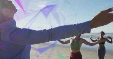 Instructor raising arm starting camera pullback showing beach yoga chest opening pose with overlay. Outstretched, harmony, meditation, outdoor, fitness, mindfulness, serenity