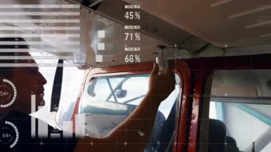 Rehber pilotun uçak veri tabloları altında havalandırma düğmesini ayırdığını ve denetlediğini tespit ettik. Teknisyen, uçak, kokpit, analiz, bakım, dijital, havacılık