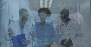 Medical team analyzing patient vitals while nurse swiping clear tablet triggers holographic charts. Healthcare, collaboration, innovation, diagnostics, technology, professionalism, teamwork