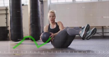 Woman entering gym area and starting Russian twists with medicine ball strengthening core muscles. Fitness, strength, workout, dynamic, training, health, athleticism