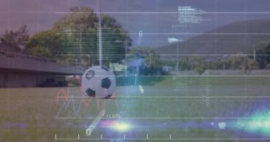 Female athlete entering frame and kicking soccer ball as tech HUD updating data. Sports, analytics, performance, tech, stadium, fitness, digital