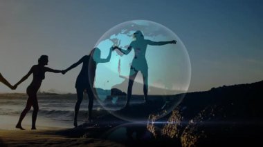 Teknoloji gösterisinde dünyanın çevresini hareketlendiren son kadın olarak el ele tutuşan kadınlar. Arkadaşlık, birlik, işbirliği, bağlantı, doğa, güç, uyum.