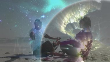 Plajda avuçlarını açık tutan çift, teknoloji için ağ ışıklarıyla dijital küreyi başlatıyorlar. Ruhani, farkındalık, bağlantı, dinginlik, fütürizm, sükunet, tefekkür