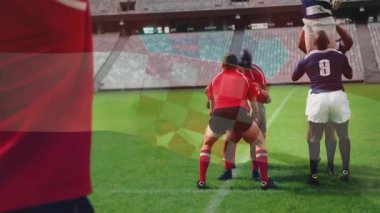 Fahişe ragbi sahasında top atıyor, kaldırıcılar çizgili atlamacı olarak paraşütçü yetiştiriyor ve kontrolü ele geçiriyorlar. Atletizm, takım çalışması, rekabet, strateji, hareket, hareket bulanıklığı, açık hava