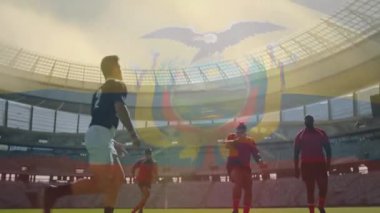 Hakem ragbi topunu fırlatıyor, kırmızı oyuncu sıçrıyor topu yakalıyor hücum mücadelesi yapıyor. Sporcular, yarışma, takım çalışması, açık hava, dinamik, spor, yoğunluk