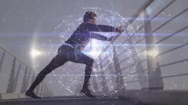 Şafak vakti köprüye adım atan bir adam dünya atımını başlatıyor. Hamle yapıyor ve zindelik için esniyor. Fitness, dayanıklılık, zindelik, kentsel, modern, aktivasyon, refah