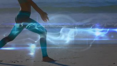 Kadın sahile adım atıyor ve savaşçı yoga pozisyonuna atlıyor. Mavi sağlık girdabını aktifleştiriyor. Meditasyon, farkındalık, dinginlik, enerji, canlılık, denge, ruhsal