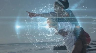 Gezgin çift kıyı şeridini gezerek ufku işaret ediyor. Veri keşfi başlıyor. Dünya dönüyor. Romantik, bağlantı, dijital, yenilik, macera, açık hava, canlı