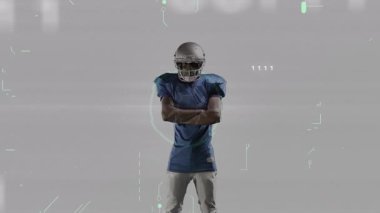 Gri sete karşı duran futbolcu ikili devre üstüste bindirip öne bakıyor. Sporcu, spor, teknoloji, yenilik, fütürizm, dijital, güç