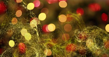 Sıcak sarı ve kırmızı bokeh ile dijital tuval sahnesinde dönen altın parçacık dalgaları. Soyut, hareketli, dijital, canlı, enerjik, parıltılı, atmosferik