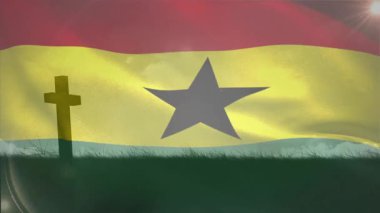 Hafif bir esinti yükseliyor tepenin üzerinde dalgalanan Gana bayrağı güneş mercekleri oluştururken ana hatları oluşturuyor. Vatanseverlik, milliyetçilik, açık hava, manzara, canlı, sembolik, ilham