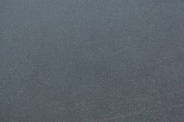 Kalıplaşmış gri yüzey düz tasarım tuvalini dolduruyor, ince tanecikli desenler gösteriyor. Minimalist, soyut, arka plan, model, nötr, modern, yüzey