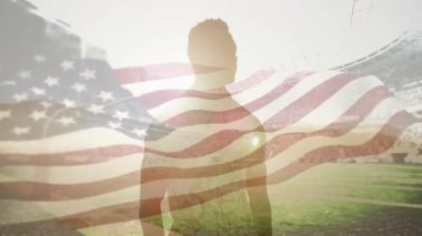 Spor sahasında duran bekar adam bayrağın yükselişini seyrediyor ve saygıyla selamlıyor. Vatanseverlik, haraç, birlik, kutlama, esneklik, gurur, bağlılık.