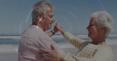 Kumsalda bir kadının elini sıkan bir adam. Dönen örtülerin altında dans eden bir çift. Yolculuk için kucaklaşan bir çift. Romantizm, eğlence, zarafet, dinginlik, hareket, uyum, kıyı