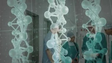 Koridorda ortaya çıkan yarı saydam 3 boyutlu moleküler iplikler vaka incelemesi yapan tıbbi personeli meşgul ediyor. Araştırma, işbirliği, yenilik, sağlık, teşhis, görselleştirme, teknoloji