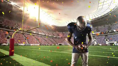 Erkek futbolcu kafa sallıyor ve konfeti altında kollarını kaldırıyor. Sporcu, spor, yarışma, zafer, kutlama, stadyum, aksiyon