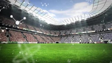 Zayıf beyaz noktalar beliriyor, titreşen kümelere bağlanıyor, sonra çözülüyor, boş stadyum ortaya çıkıyor. Teknoloji, bağlantı, yenilik, dijital, soyut, spor, gelecekçilik