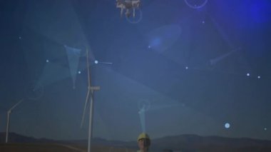 Rüzgâr çiftliğinin kontrollerini ayarlayan teknisyenler, ağ hatlı türbinleri kontrol eden drone 'lar başlatıyorlar. Drone, yenilenebilir enerji, dijital arayüz, teknoloji, coğrafi izleme, endüstriyel