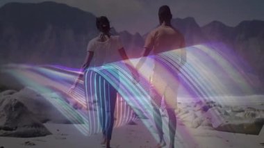 Kayalık sahilde yürüyen bir çift dijital dalga ile resimleme teknolojisi arasında bağlantı kuruyor. Romantik, bağlantı, macera, manzara, canlı, uyum, sükunet