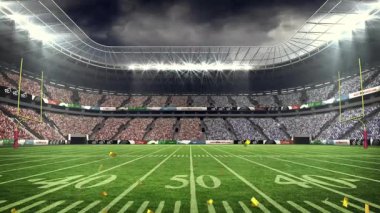 Projektör ışığı orta sahada konfetileri ateşliyor, galibiyet işareti, altın parçaları sürükleniyor. Stadyum, kutlama, cazibe, dinamik, gösteri, mimari, ışıklandırma