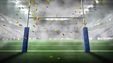 Altın konfeti salınımı mavi ragbi kalelerinin etrafında dönüyor ve kutluyor. Kutlama, şenlik, spor, zafer, heyecan, ihtişam, hareket