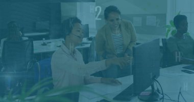 Pointing at computer monitor support agent wearing headset in office, collaborating with supervisor. Collaboration, teamwork, professional, modern, workspace, communication, technology