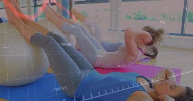 When overlay activates, women repeatedly crunching on exercise ball tracking fitness data via graph. Fitness, workout, wellness, motion, health, strength, determination