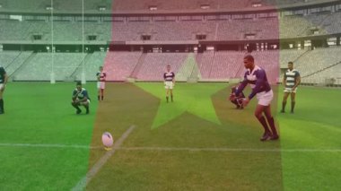 Kicker, rugby topunu 22 metreye yerleştiriyor, takım arkadaşları stadyuma atmadan önce izliyor. Sporcular, takım, yarışma, spor, stadyum, aksiyon, takım çalışması