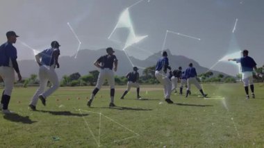 Koç, koşuya başlamadan önce beyzbol takımının dönüşümlü olarak yer değiştirmesini işaret ediyor. Atletizm, takım çalışması, dijital, fütüristik, eğitim, yenilik, açık hava