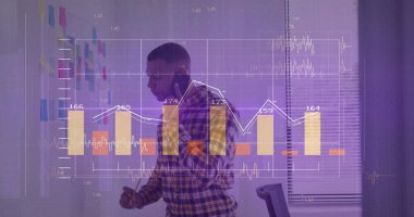 Holding smartphone business analyst in plaid annotating chart on glass board in office with marker. Collaboration, strategy, planning, data, presentation, innovation, productivity