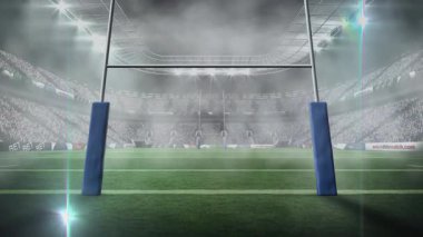 Projektörler teker teker ragbi direklerini aydınlatarak sisi sislerden temizliyor. Stadyum, aydınlatma, atmosfer, spor, aydınlatma, arena, profesyonel