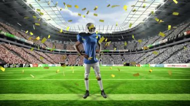 Futbolcu kollarını kaldırarak konfetiye tepki veriyor, spor pazarında grafikleri süpürüyor. Sporcu, kutlama, şenlik, dinamik, stadyum, zafer, takım çalışması