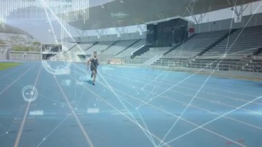 Male athlete launching into sprint on start signal overlaying sports performance heart rate metrics. Athlete, stadium, digital overlays, performance, biomechanics, speed, endurance