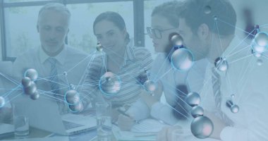 Reviewing laptop charts colleagues wearing formal attire in conference room, with molecular overlay. Corporates, teamwork, innovation, analysis, communication, technology, workspace