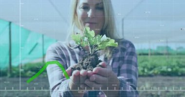 Kadın tarım serasında tohum kaldırıyor, şebekeyi ortaya çıkarıyor ve veri takibi büyümesini sağlıyor. Bahçecilik, izleme, yenilik, sürdürülebilirlik, tarım, veri görselleştirme, büyüme