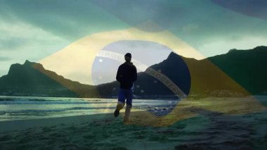 Animasyon Brezilya bayrağı beliriyor, plajda yürüyen adam, seyahati kutlayan kollarını kaldırıyor. Vatanseverlik, başarı, azim, macera, manzara, doğa, güven