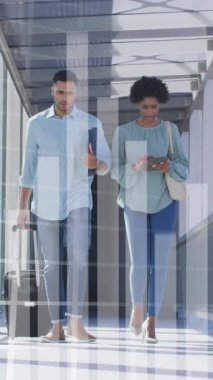 Animation of financial data processing over diverse business people discussing work at office. Global business, finances and digital interface concept digitally generated video.