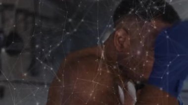 Ringde ağırlık değiştiren boksör, spor analitiği ile yumruklama izleme hızı ve etkisi örtüşüyor. Sporcu, fitness, dinamizm, teknoloji, güç, performans, kararlılık