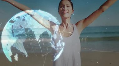 Kumsalda kollarını kaldıran ve dünyayı döndüren hologramın hızlanmasına ve teknolojik demonun çözülmesine neden olan bir kadın. Küresel, gelecekçilik, yenilik, bağlantı, güçlendirme, dinginlik, teknoloji