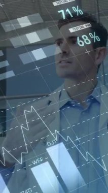 Animation of financial data over caucasian male doctor and paramedics talking. finance, economy, medicine, health and technology concept digitally generated video.