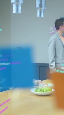 Animation of data processing over diverse business people in office. Global business, finances, computing and data processing concept digitally generated video.