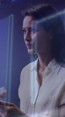 Animation of financial data processing over diverse business people working in office. Global business, finances, computing and data processing concept digitally generated video.