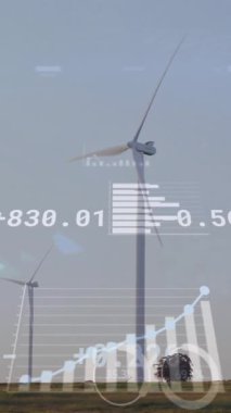 Rüzgâr türbinleri üzerinde finansal veri işleme animasyonu. Küresel ekoloji, finans, enerji ve dijital arayüz kavramı dijital olarak oluşturulmuş video.