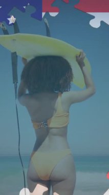 Amerikan bayrağı yapbozunun animasyonu, sahilde kafasında sörf tahtası taşıyan bir kadını ortaya çıkarıyor. ABD vatanseverliği ve demokrasi kavramı dijital olarak oluşturulmuş video.