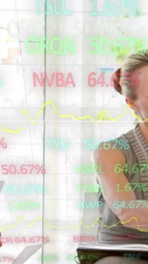 Animation of stock market data processing over diverse businesspeople discussing together at office. Global economy and business technology concept