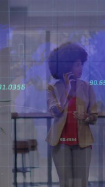 Animation of numbers and data processing over diverse business people in office. Global business, finances, computing and data processing concept digitally generated video.