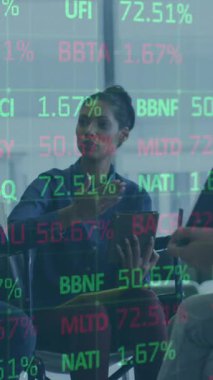 Animation of financial data processing over diverse business people. Global business, finances, computing and data processing concept digitally generated video.