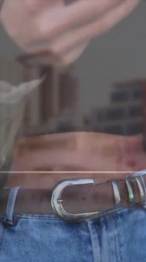 Animation of like icons with increasing numbers against mid section of woman using smartphone. Social media networking and business technology concept